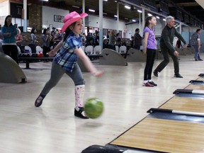 Maci Dubblestein, 9, on the All-Risks Insurance fundraising team that raised $500, at the Bowl for Kids Sake in Kingston, Ont. on Saturday March 28, 2015. Steph Crosier/Kingston Whig-Standard/QMI Agency