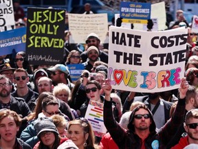 Demonstrators gather at Monument Circle to protest a controversial bill recently signed by Governor Mike Pence in Indianapolis, March 28, 2015. (NATE CHUTE/Reuters)