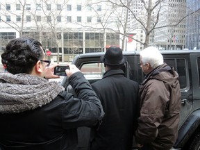 Taxi drivers surrounded a car driven by an UberX driver in Montreal, March 27, 2015. (CHRISTOPHER NARDI/QMI Agency)