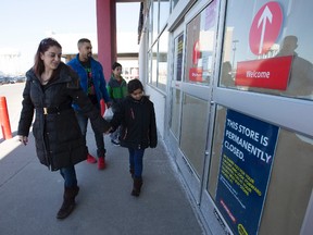 The Cost and Flash family arrive at the Future Shop store at Warden and Eglington on March 28, 2015 and find out that it has permanently closed. (Craig Robertson/Toronto Sun)