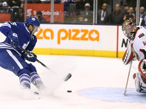 Mar 28, 2015; Toronto, Ontario, CAN; Toronto Maple Leafs center Joakim Lindstrom (15) fails to score on a penalty shot as Ottawa Senators goalie Craig Anderson (41) guards the net at Air Canada Centre. Mandatory Credit: Tom Szczerbowski-USA TODAY Sports