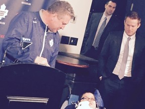 Saskatchewan’s Garrett Gamble, 11, is introduced during a press conference on Saturday morning at the Air Canada Centre alongside Maple Leafs interim head coach Peter Horachek. (IAN SHANTZ/TORONTO SUN)