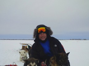 Toronto Police Insp. Heinz Kuck, the commander of 11 Division, with three dogs at the foot of James Bay. (PHOTO BY PHIL JONES)