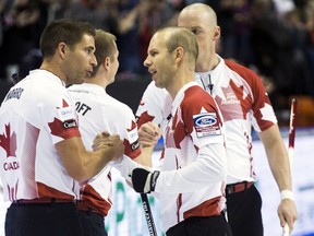 Canada skip Pat Simmons celebrates with his team John Morris, Carter Rycroft, and Nolan Thiessen after defeating the U.S. during the second draw of the World Men's Curling Championships March 28.  (REUTERS/Mark Blinch)