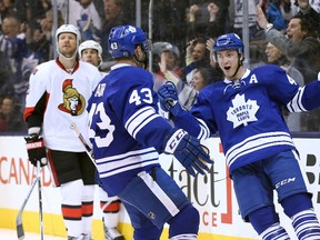 Maple Leafs centre Tyler Bozak (right) celebrates his hat trick against the Ottawa Senators on Saturday night at Air Canada Centre. (USA TODAY Sports)
