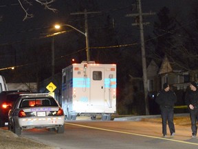Emergency officials on Nanwood Dr. in Brampton after a woman's body was found in a home early Sunday, March 29, 2015. (Andrew Collins photo)