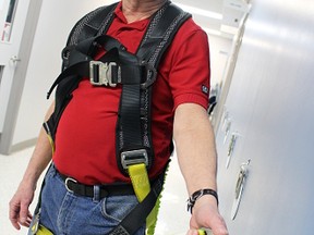 Instructor Steve Spradbrow demonstrates some of the harness training equipment at the Industrial Education Co-Operative in Sarnia. The IEC is rolling out a new provincially mandated working at heights training program April 1. TYLER KULA/ THE OBSERVER/ QMI AGENCY