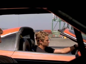 Dominic Toretto (Vin Diesel) and Brian O’Connor (Paul Walker) drag race in a scene from "The Fast and The Furious." (Screenshot)