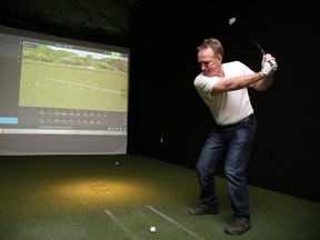 Local golfer Jari Sundholm uses the TrackMan golf simulator at Discount Golf last week. Discount Golf has purchased and set up two of the advanced golf simulators at its New Sudbury store.