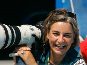 Anja Niedringhaus laughs as she attends a swimming event at the 2004 Olympic Games in Athens, Aug. 21, 2004. (Reuters)