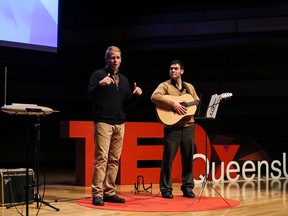 Kingston mental health crisis workers Chris Trimmer, left, and Richard Tyo make a presentation about music and mental health at the Isabel Bader Centre for the Performing Arts on Sunday. (Tiffany Lam/TEDxQU)