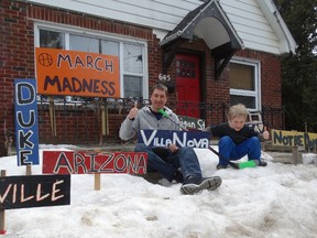 Dominique Rudy, left, shows signs of March Madness superfandom at his south London home. But son Cameron, 5, is all about Habs hockey. (JANE SIMS, The London Free Press)