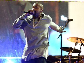 Kanye West performs during the World AIDS Day (RED) concert in Times Square in New York on December 1, 2014. West is  playing Ottawa Bluesfest Friday. AFP PHOTO / Timothy A CLARY