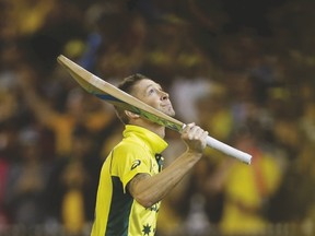 Australia’s captain Michael Clarke looks to the sky after winning the World Cup in tribute to fallen teammate Phillip Hughes, who died earlier this year. (REUTERS)
