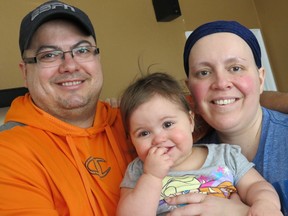 Tanya Lafleur, right, is pictured with her husband, Kevin, and their daughter Magen in Welland, Ont., on March 29, 2015. (Greg Furminger/QMI Agency)