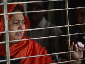 A relative of dead Bangladeshi blogger Washiqur Rahman reacts after seeing his body at Dhaka Medical College in Dhaka on March 30, 2015. (AFP PHOTO/Munir uz Zaman)