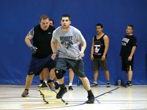 Sudbury Spartans take part in dryland training drills at Laurentian University on Sunday night.