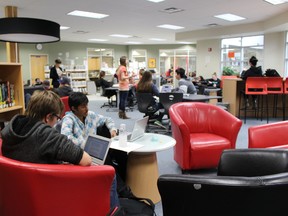 (From left) Grade 10 students Justin Cooper and Keerthivasan Kumaran were using chromebooks last week while at Frank Maddock’s learning commons. Both chromebooks and learning commons centre were result of funding that came from the credit incentive program.