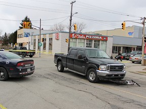 One cyclist was taken to hospital after a Monday afternoon collision at Wellington, Ontario and Mitton streets, police said. Wellington Street, just east of Mitton is seen closed here for the investigation. (TYLER KULA/ THE OBSERVER/ QMI AGENCY)