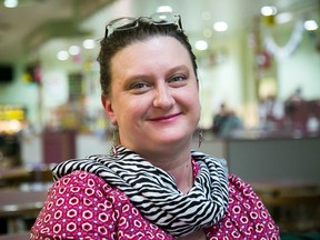 Laurie Gashinski shows off a zebra print scarf at Quinte Bowl in Belleville last Wednesday. The zebra print is the international awareness symbol for neuroendocrine cancer which she has been battling for eight years. - Tim Miller/The Intelligencer