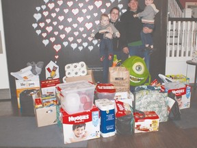 Pictured here (from left to right) are Connor, Stacey, Mike and Kaleb at the Ronald McDonald House in London as they proudly display all of the items that they were able to collect for the special care centre.