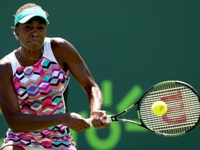 Venus Williams returns a shot to Caroline Wozniacki of Denmark during day 8 of the Miami Open. (Matthew Stockman/AFP)