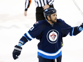 With just six games remaining in their schedule, Dustin Byfuglien will be trying to lead the Jets to the playoff promised land. (USA Today Sports)