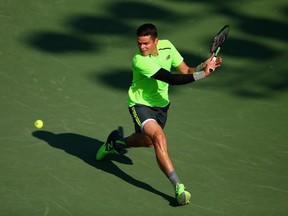 Milos Raonic of Canada plays a backhand against Jeremy Chardy of France in their third round match during the Miami Open Presented by Itau at Crandon Park Tennis Center on March 30, 2015 in Key Biscayne, Florida.  Clive Brunskill/Getty Images/AFP