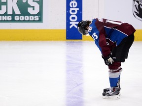 An Avalanche player reacts to the overtime loss to the Minnesota Wild in Game 7of the first round of the 2014 playoffs. (USA TODAY SPORTS)