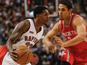 The Raptors' Lou Williams gets past Houston Rockets' Nick Johnson at the ACC on Monday night. (Dave Thomas/Toronto Sun)