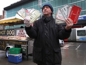 Hot dog vendor Terry Scanlon poses for a photo at his hot dog cart on Bank Street in Ottawa Monday, March 30, 2015. Scanlon thinks that the City of Ottawa should let him re-sell his vendor plate. (Tony Caldwell/Ottawa Sun/QMI Agency)