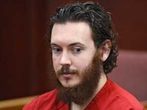 James Holmes sits in court for an advisement hearing at the Arapahoe County Justice Center in Centennial, Colorado, in this file photo taken June 4, 2013.  The first of some 9,000 potential jurors will report to court in Colorado on Tuesday as selection begins for the trial of Holmes, the former neuroscience graduate student who killed 12 people in July 2012 at a midnight screening of a Batman movie.