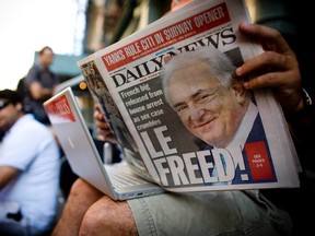 A man reading an issue of the New York Daily News. 

REUTERS/Allison Joyce