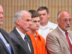 Attorney Edward Gavin, Christopher Plaskon's uncle and guardian Paul Healy, Plaskon and attorney Richard Meehan, Jr.

REUTERS/Arnold Gold/Pool