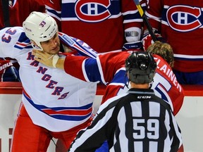 Andre Deveaux in a fight during his brief stint with the New York Rangers. (QMI Agency)