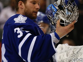 Toronto Maple Leafs James Reimer checks his mask on Friday, March 27, 2015. (Jack Boland/Toronto Sun)