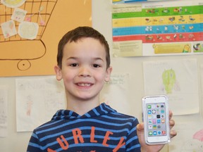 Eight year-old Noah Stokes shows off his brand new iPod Touch, which he won by creating a healthy, kid-friendly recipe for the EatRight Ontario Kids Recipe Challenge. The High Park school student came up with a salsa chicken casserole recipe.
CARL HNATYSHYN/SARNIA THIS WEEK/QMI AGENCY