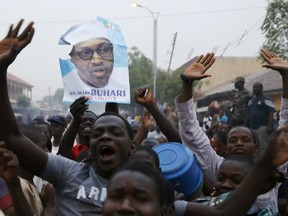 Supporters of the presidential candidate Muhammadu Buhari and his All Progressive Congress (APC) party celebrate in Kano March 31. (REUTERS/Goran Tomasevic)