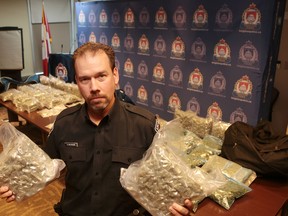 Kingston police display the almost $220,000 worth of marijuana and cocaine they seized on the weekend. (Elliot Ferguson The Whig-Standard)
