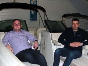 John Cowan, left, recently purchased Bill and Sandy Douglas' share of Needham's Marine Ltd. in Sarnia, and is now co-owner along with Nick Salomone. The new owners are pictured on a new boat on Wednesday March 25, 2015 in Sarnia, Ont. Terry Bridge/Sarnia Observer/QMI Agency