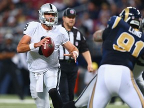 Matt Schaub of the Oakland Raiders looks to pass against the St. Louis Rams in the fourth quarter at the Edward Jones Dome on November 30, 2014. (Dilip Vishwanat/Getty Images/AFP)