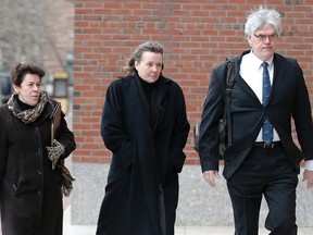 Defense attorneys (L-R) Miriam Conrad, Judy Clarke and Timothy Watkins arrive at the federal courthouse on the second day of jury selection in the trial of accused Boston Marathon bomber Dzhokhar Tsarnaev in Boston, Massachusetts in this January 6, 2015 file photo. Tsarnaev's high-powered defense team will take the spotlight after prosecutors rest their case. REUTERS/Brian Snyder/Files