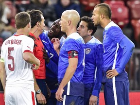 United States' Jozy Altidore (3rd L) argues with referee Luca Banti (2nd L) after receiving a red card on March 31, 2015 during a friendly football match between Switzerland and the United States at the Letzigrund stadium in Zurich. (AFP PHOTO / MICHAEL BUHOLZER)