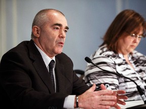 Bob Kingston, president of the Agriculture Union, and Marianne Hladun, prairie regional executive vice-president of the Public Service Alliance of Canada, speak to the media at the Fairmont Hotel in Edmonton, March 31, 2015. (IAN KUCERAK/QMI Agency)