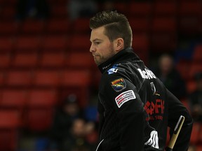 Mike McEwen reacts after his final rock came to rest during the Safeway Championship provincial men's curling event at Keystone Centre in Brandon, Man., on Sun., Feb. 8, 2015. (Kevin King/QMI Agency)