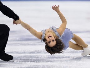 Lively's Meagan Duhamel (R) and  Eric Radford of Canada perform during the pairs short program of the 2015 ISU World Figure Skating Championships at Shanghai Oriental Sports Center in Shanghai, on March 25. The duo won gold for their first world championship title.