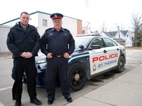 Fanshawe College student Kodi Hansen, left, stands with St. Thomas deputy police chief Jeff Driedger, next to a city police cruiser. Hansen is one of two Fanshawe students completing field placements with city police in March and April. (Ben Forrest, Times-Journal)