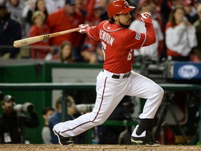 Washington Nationals third baseman Anthony Rendon (6) hits a single in the eighth inning against the San Francisco Giants in game two of the 2014 NLDS playoff baseball game at Nationals Park.  H. Darr Beiser-USA TODAY Sports
