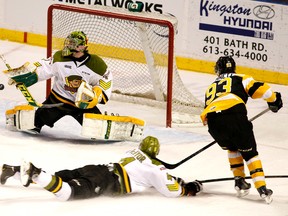 Kingston Frontenacs’ Sam Bennett shoots wide of North Bay Battalion goalie Jake Smith as defenceman Marcus McIvor slides by during Game 3 of an Ontario Hockey League Eastern Conference quarter-final playoff series at the Rogers K-Rock Centre on Tuesday. North Bay won 3-1 to take a 3-0 serieis lead. (Annie Sakkab/For The Whig-Standard)