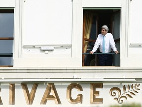 U.S. Secretary of State John Kerry looks out of his room at the Beau Rivage Palace Hotel during a break during the Iran nuclear program talks in Lausanne April 1, 2015. Iran hopes to conclude talks with six major powers on a preliminary accord on reining in its nuclear programme by Wednesday night, its senior nuclear negotiator said. REUTERS/Ruben Sprich